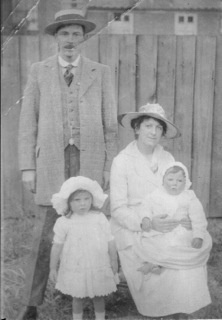 Archie, Wife with Ann and Gladys on Lap